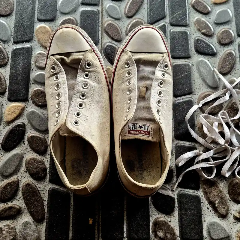 My Converse All Stars before cleaning — yellowed canvas and dark grime around the collar and toe cap
